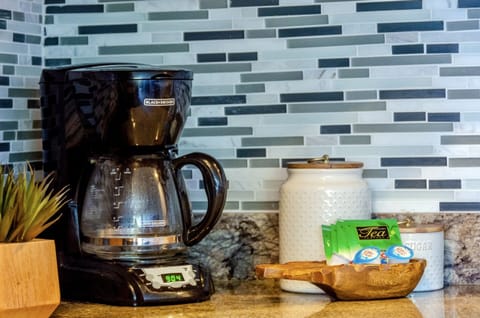 Coffee maker with coffee provided.