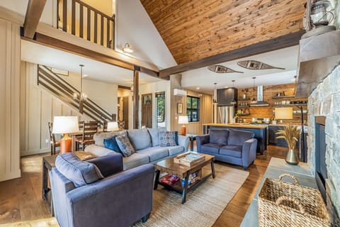 Spacious well lighted great room with comfortable couch perfect for family and friends gathering