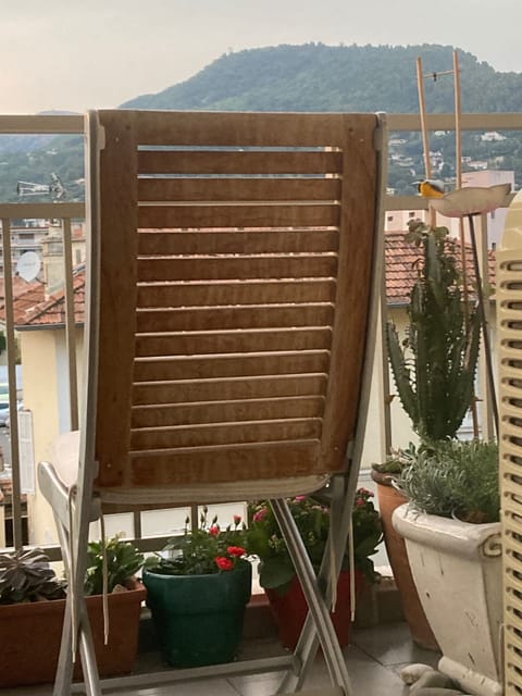 View of mountains and historic village from studio apartment balcony.