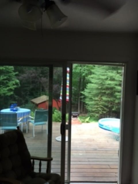 Rocking chair and ceiling fan overlooking back deck and special Art Archive.