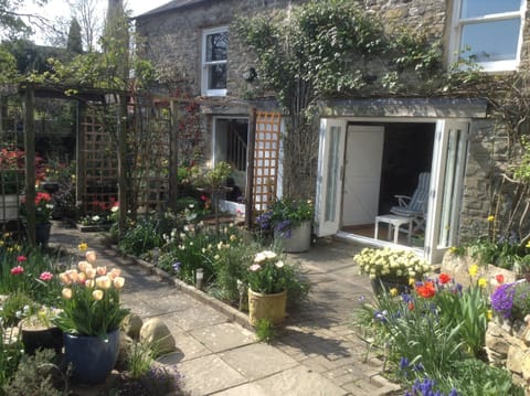 Outdoor area in front of barn, with  sunroom doors open