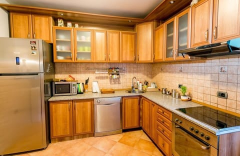 The fully equipped kitchen with all necessary amenities.
