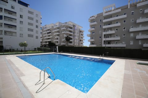 Swimming pool with security fence, shallow and deep ends, plus showers.