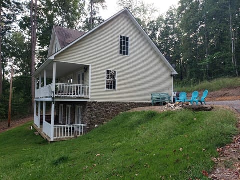 Side view of house coming up driveway 
