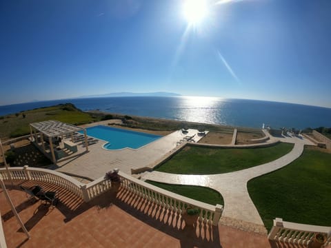 View from kitchen terrace over the pool and BBQ area towards the Ionian sea
