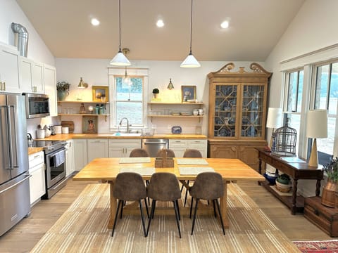 fully stocked kitchen, open to living room