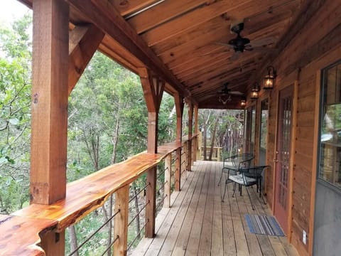 Porch View from BBQ Station. 2 Ceiling Fans, Seating, Handcrafted Railing & View