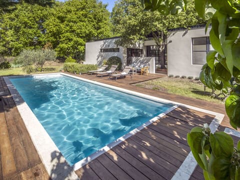 Water, Plant, Swimming Pool, Azure, Shade, Building, Outdoor Furniture, Chair, Tree, Grass