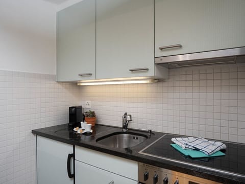 Kitchen, Countertop, Kitchen Appliance, Kitchen Sink, Plumbing Fixture, Sink, Interior Design, Major Appliance, Tap, Cabinetry