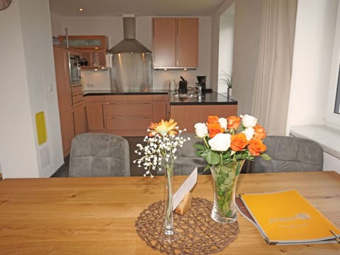 Flower, Table, Furniture, Property, Vase, Tableware, Interior Design, Orange, Wood, Lighting