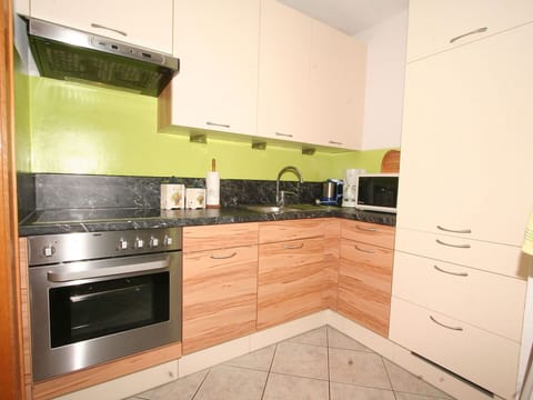 Property, Countertop, Kitchen, Cabinetry, Room, Furniture, Kitchen Stove, Major Appliance, Tile, House