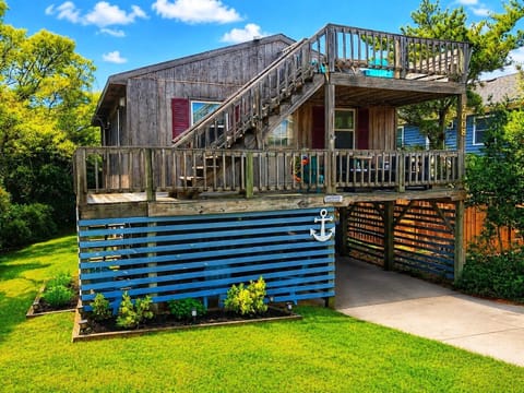 Your elevated beach escape awaits—blue skies, coastal breezes, and two levels of spacious decks made for your morning coffee or sunset views. This raised retreat is yours to relax, recharge, and enjoy.