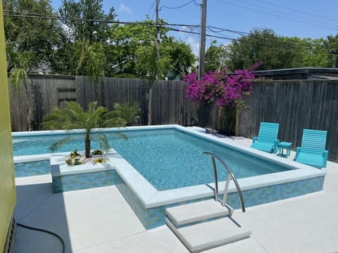 Great Swimming Pool! Covered patio,   outdoor furniture, and a gas grill! 