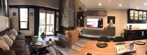 Living room area features plenty of entertaining space by the gas fire.