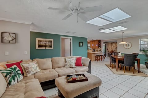- Enjoy a seamless open concept layout connecting the living, dining, and kitchen areas
- Plenty of space for relaxing, entertaining, or dining with your group
- Skylights and cheerful colors create an inviting vacation ready vibe