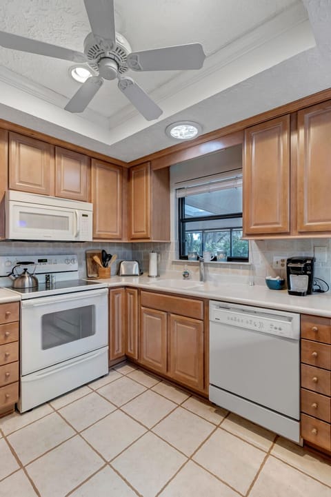 - Enjoy coffee prep with a view from this inviting corner kitchen space
- Equipped with microwave, dishwasher, toaster, and modern coffee maker
- Plenty of counter space and under cabinet lighting make mornings effortless