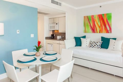 Studio: dining table with kitchenette. It includes 1 king and 2 twin-size beds.