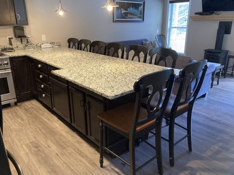 Friends and family can share stories of the day's adventures around the spacious kitchen counter. 