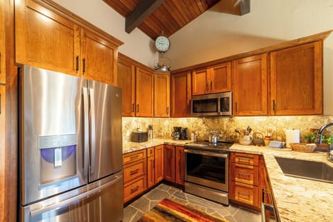 Remodeled kitchen w/ new cabinets and stainless steel appliances.
