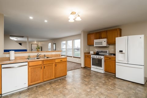 large kitchen with basic kitchen supplies