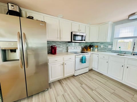 Newly upgraded fully stocked kitchen - new Frigidaire stainless steel fridge