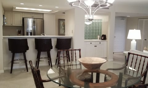 Bar with seating open to the kitchen