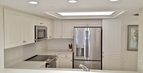 Spacious kitchen with new stainless appliances and views of the gulf
