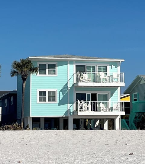 Two stories, on the sand, front row view of everything.