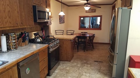 Kitchen with small island for two and nook for six.