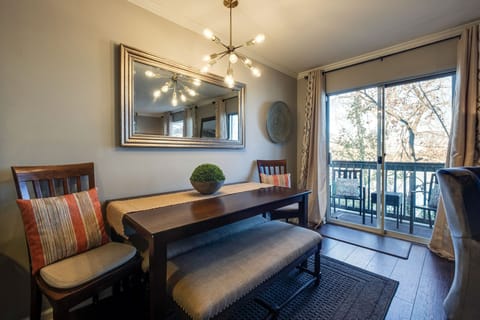 Dining area overlooks the deck with a view of the river