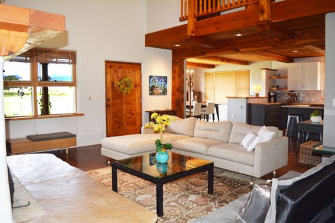 Open view through living room into kitchen and dining room