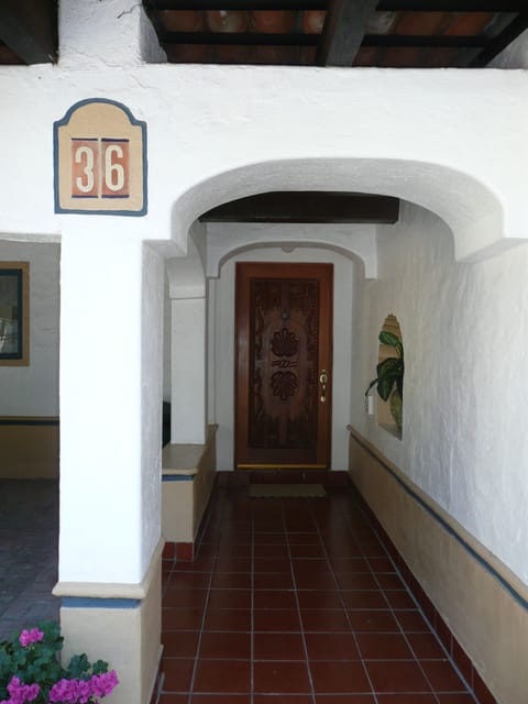 Front entrance with custom carved front door
