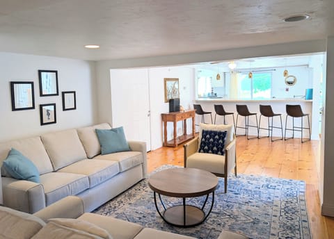 Large, spacious living room with beautiful pine floors.