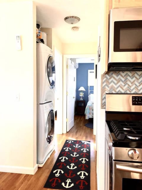 Hallway which leads to the washer and dry unit, bedrooms and bathrooms.