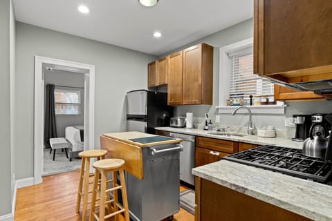 Fully stocked kitchen w/ Island & stainless steel appliances & children's dishes