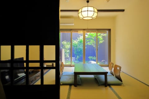 A living room with a view of the garden that colors every season