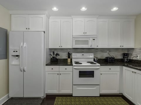 Kitchen- Fully stocked - fridge, range, dishwasher, microwave, stackable washer/dryer and a Mr. Coffee