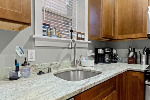 Deep D-bowl sink for easy dish cleaning, spices, coffee & espresso are provided