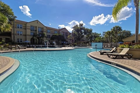 Picture your day from above—pools, cabanas, palms, pure calm.