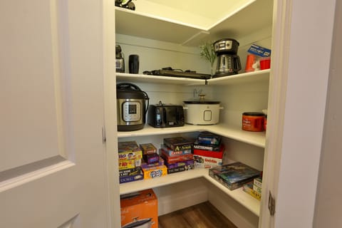 View of the kitchen pantry + a large selection of games