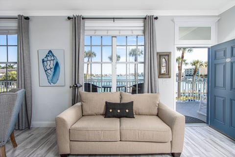 Welcome to Dock Holiday! Enjoy the water views from the windows or balcony.