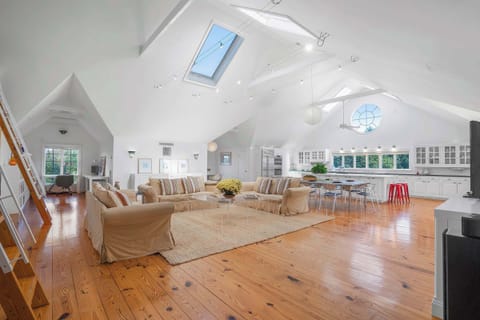 Stunning open great room with soaring ceilings and skylights