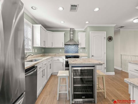 Modern kitchen with stainless steel appliances and cozy breakfast nook