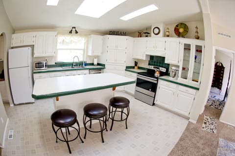 Kitchen with island and skylights