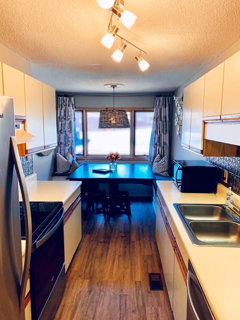 Galley kitchen with dining nook for 12
