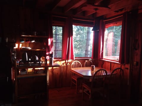Dining corner. Pots and pans for your use along with propane cookstove.