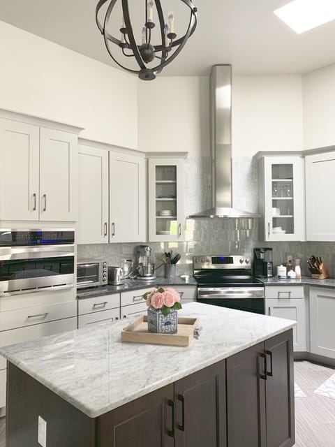 Kitchen features marble and granite counters, ss appliances & conv. oven