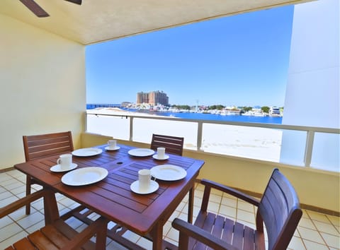 Covered Balcony with dining table and sweeping views!