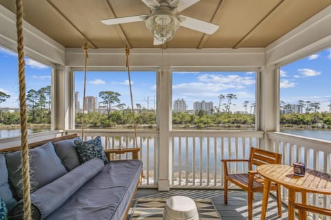 Relax on the porch screen while listening to the gentle sounds of the surf