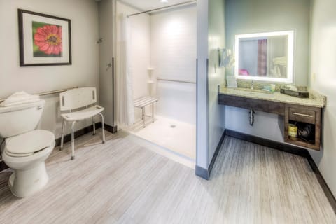 Get ready for the day in the modern and bright accessible bathroom.
